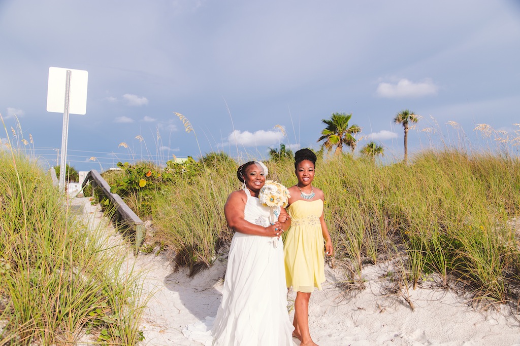 Beach Bride Walking Down the Aisle in the Sand