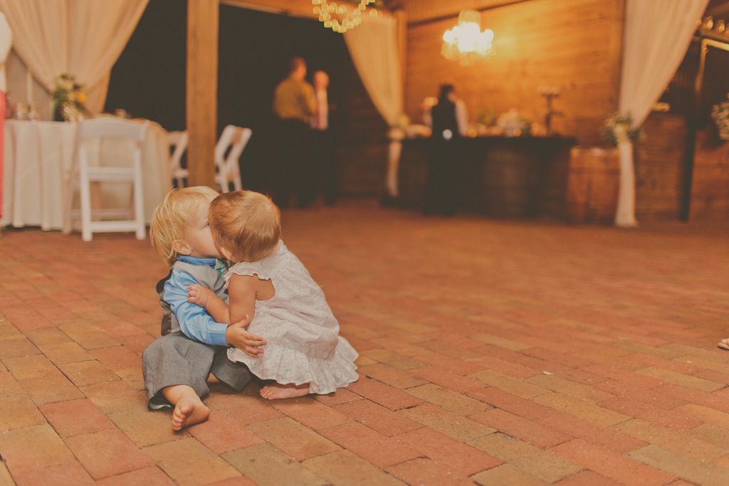 Two Kids Kissing at Wedding