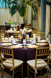 St. Pete Museum of Art Wedding Reception with Purple Linens and Gold Chargers and Gold Chiavari Chairs