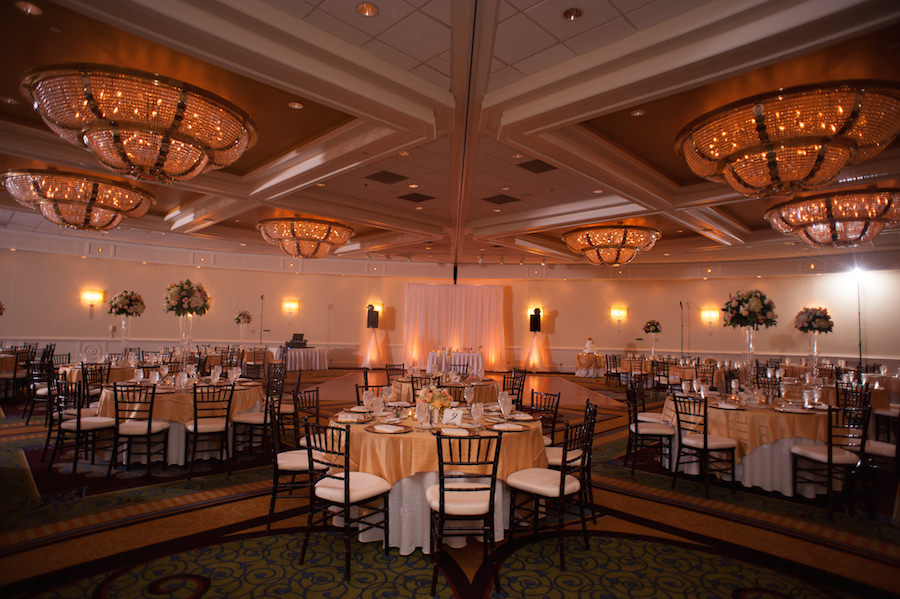 Tampa Ballroom Wedding Reception with Chiavari Chairs and Amber Uplighting | Tampa Airport Marriott
