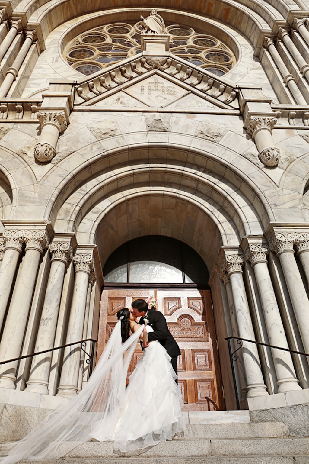 Bride and Groomon Church Steps | Sacred Heart Catholic Church Downtown Tampa Wedding