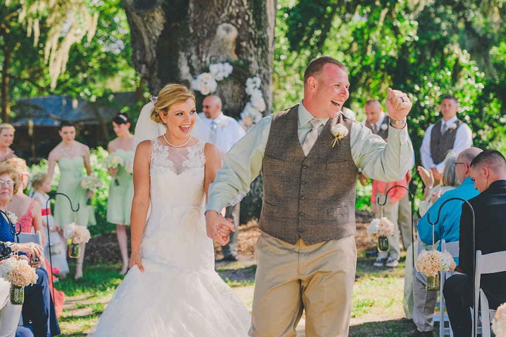 Bride and Groom Walking Down the Aisle at Wedding Ceremony