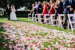 Bride and Father Walking Down Rose Petal Wedding Aisle