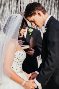 Bride and Groom Praying During Wedding Ceremony