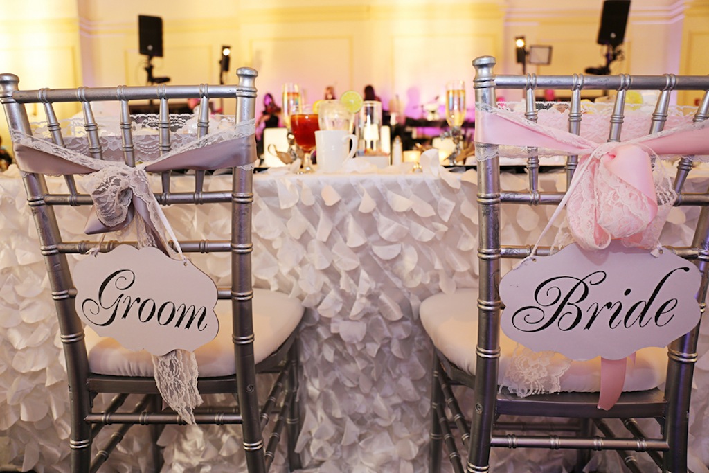Silver Chiavari Wedding Chairs at Sweetheart Table with Bride and Groom Signs
