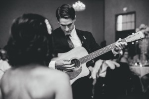 Groom Playing Guitar during Wedding Ceremony