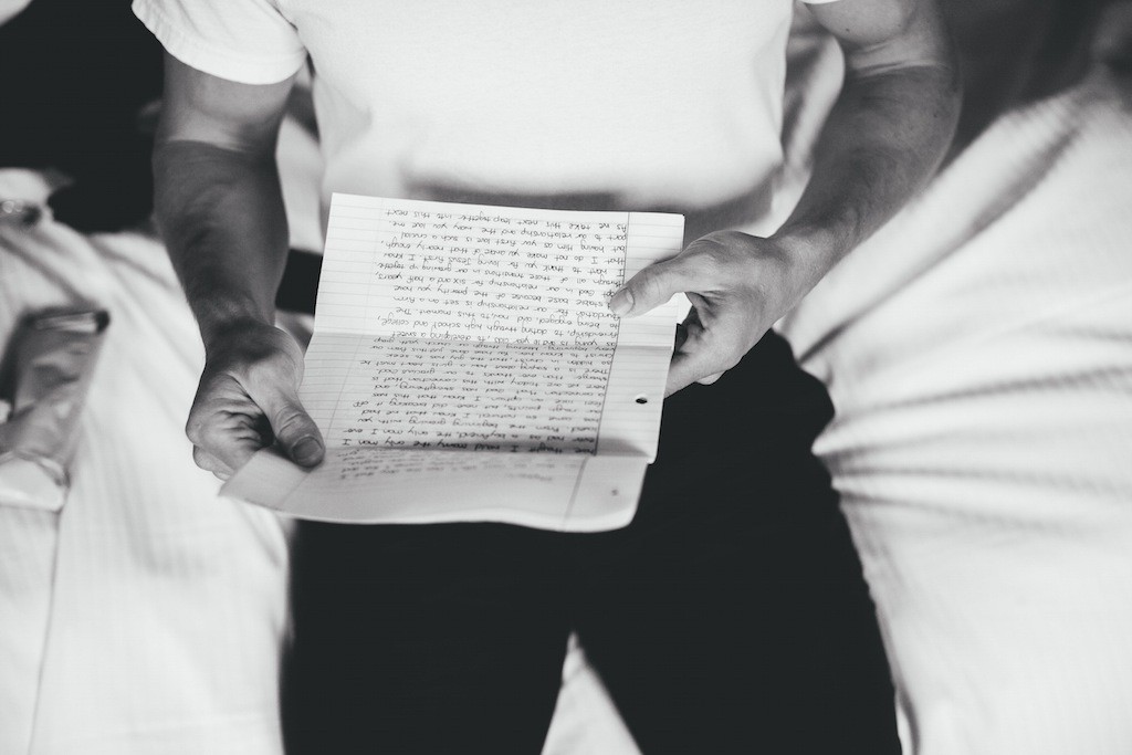 Groom Getting Ready Reading Bride's Letter on Wedding Day