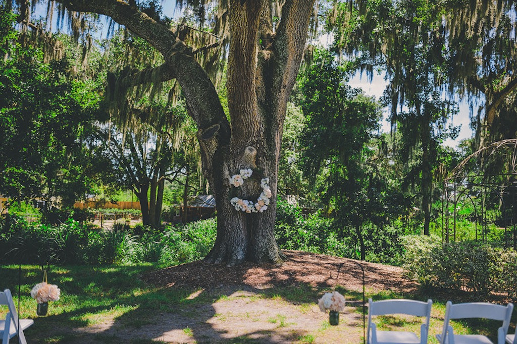 Rustic Outdoor Wedding Ceremony Under Large Tree - Cross Creek Ranch