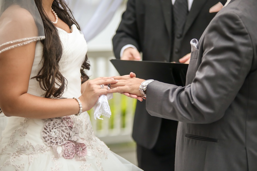 Bride and Groom Exchanging Wedding Rings