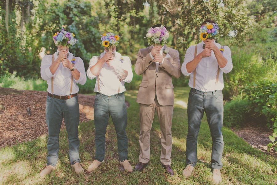 Rustic Groomsmen with Suspenders Holding Wedding Bouquets