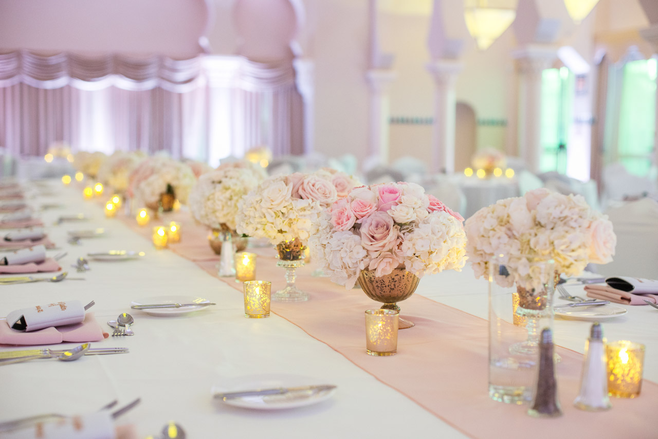 White Wedding Reception with Long Feasting Tables, Pink Runner and Low White, Pink and Gold Wedding Centerpieces