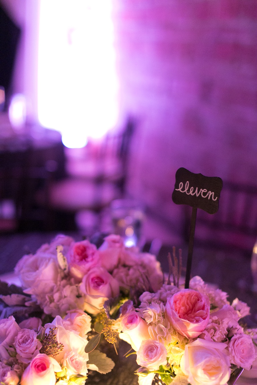 26 Pastel Pink and White Low Wedding Centerpieces with Purple Uplighting | NOVA 535.jpg