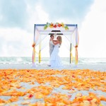 Orange and Red Beach Wedding Ceremony with Wooden Alter and Chandelier | Tide the Knot Beach Weddings