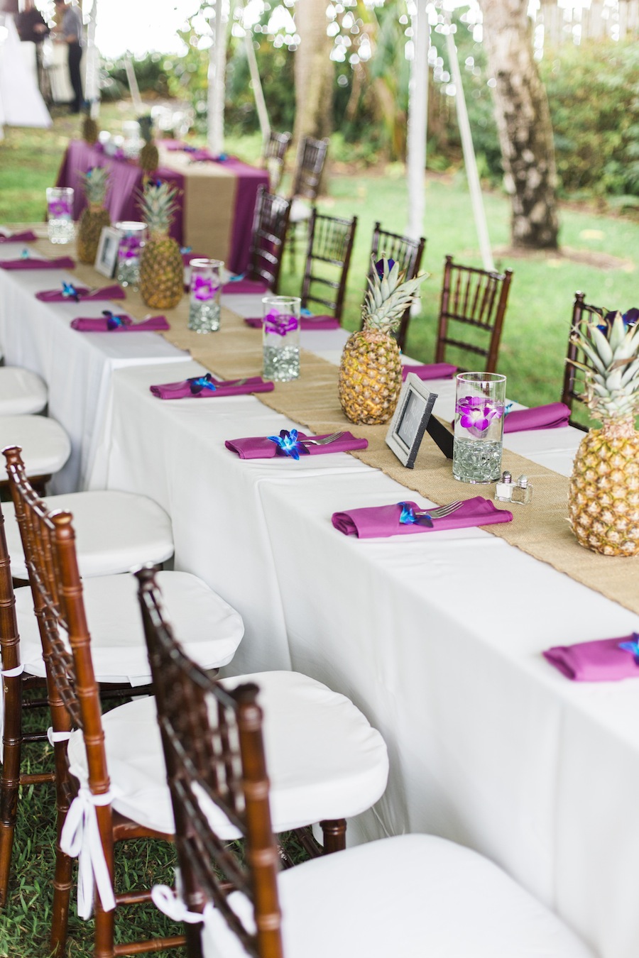 Tropical Pink, Purple and Blue Wedding Reception Feasting Table | Pineapple Wedding Centerpieces