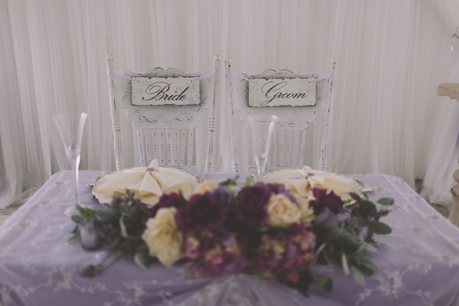 Purple and Lavender Wedding Reception Decor | Rustic Bride and Groom Sweetheart Table Chairs with Lavender Linens