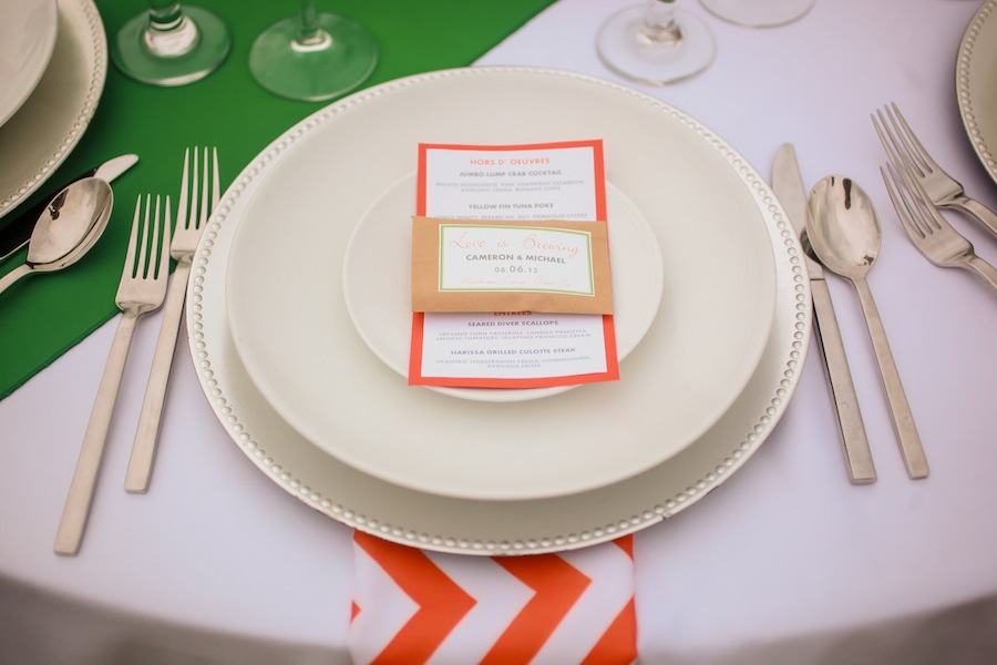 Silver Chargers and Orange Linens | Citrus Themed St. Pete Beach Wedding| Blue Skies Events