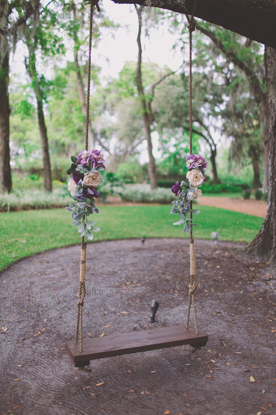 Vintage Wooden Tree Swing with Wedding Flowers | Cross Creek Ranch Wedding