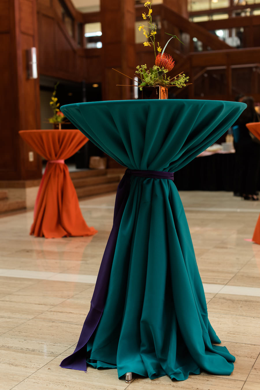Tropical Orange Wedding Centerpieces with Teal and Orange Specialty Linen | Coast to Coast Event Rentals | St. Petersburg Wedding Florist Wonderland Floral Art and Gift Loft