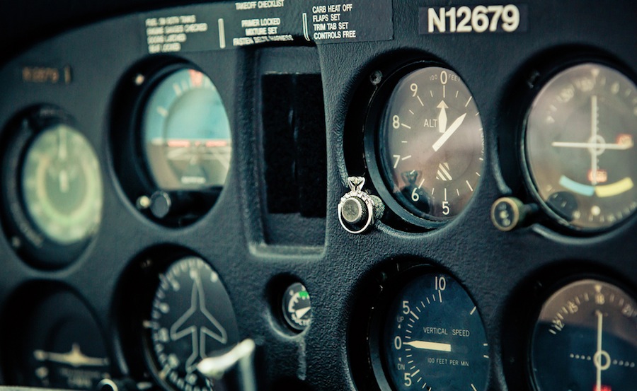 Engagement Session in Plane with Wedding Ring | Plant City Vintage Airport Engagement Shoot