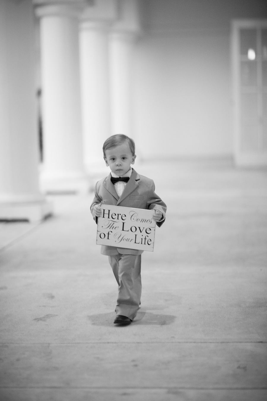 Ringer Bearer Holding "Love of Your Life" Sign Walking Down the Wedding Aisle