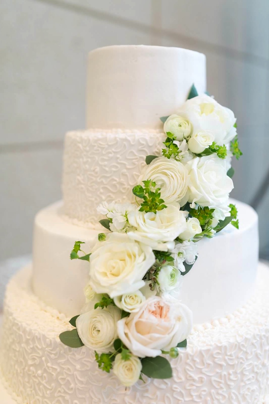 White Cascading Wedding Cake Flowers | St. Pete Wedding Florist Wonderland Floral Art