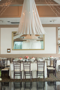 White Wedding Reception Decor with Ceiling Draping and Chiavari Chairs | Tampa Wedding Venue The Rusty Pelican