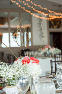 Wedding Reception Decor with White and Coral Rose Centerpieces and String Lighting
