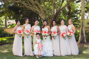 White Ruffled Wedding Dress with Champagne Bridesmaid Dresses by Wtoo and Orange Wedding Bouquets