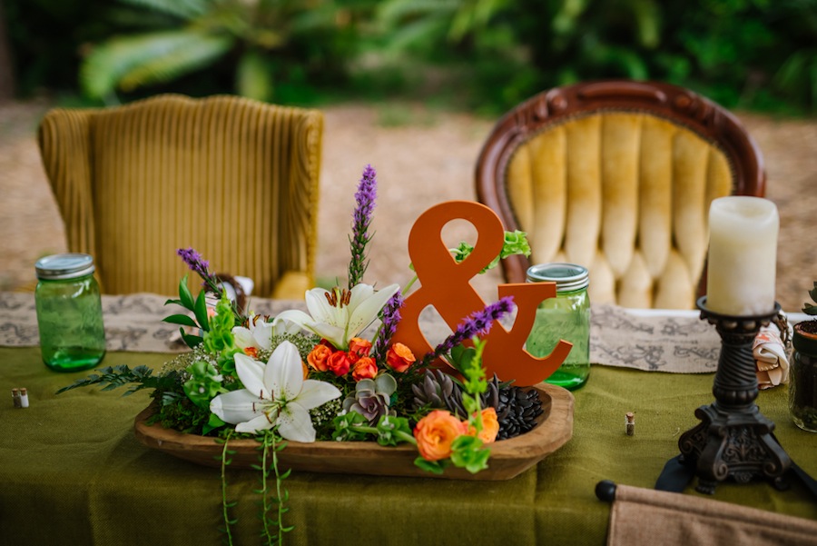 Outdoor Garden Wedding Reception with Tropical Flowers and Vintage Chairs | Tufted Vintage Rentals
