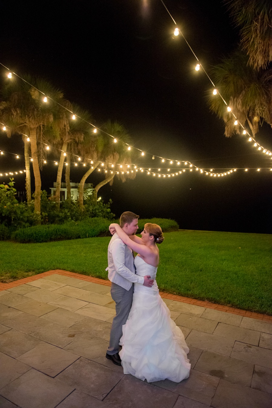 Outdoor Wedding Reception Sarasota Bride and Groom Dancing with String Lighting | The Bay Preserve at Osprey