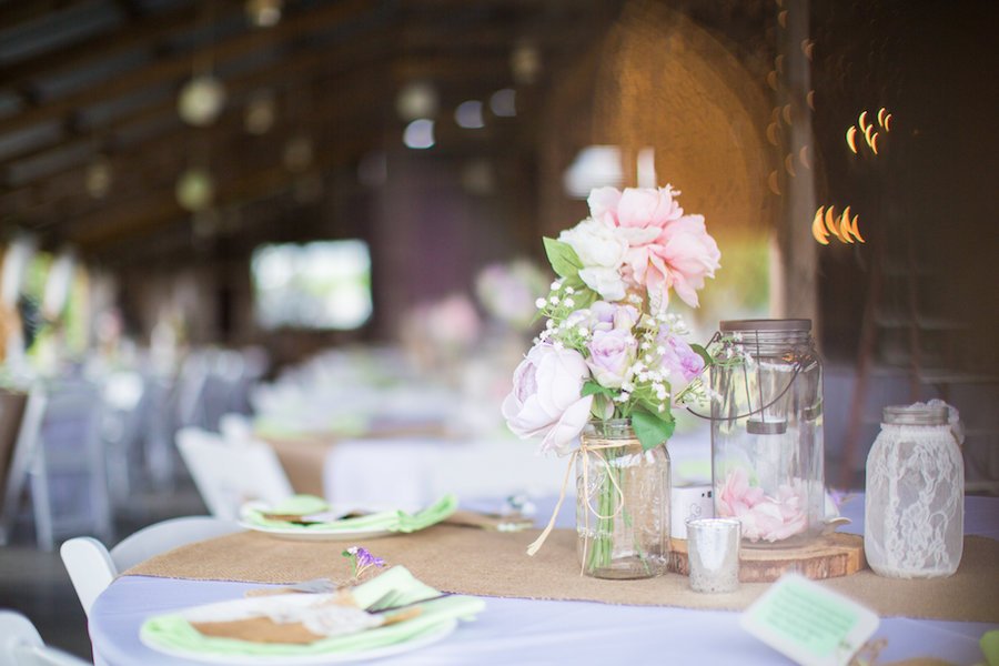 Rustic Wedding Reception Centerpieces with Pink & Purple Flowers Mason Jars and Burlap Runners | Plant City Wedding Venue Wishing Well Barn