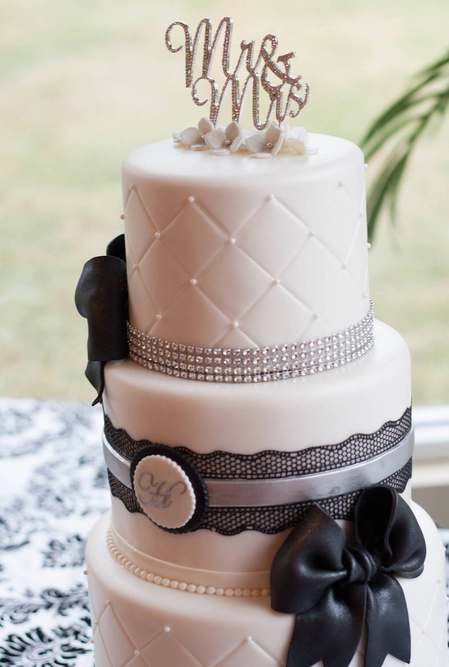 Elegant White Quilted Wedding Cake with Black Lace Ribbon | St. Pete Wedding Cake & Pastry Chef | Trudy Melissa Cakes
