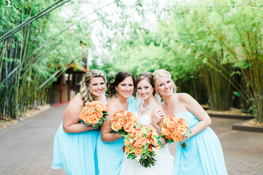 Bridal Party Portraits with Turquoise Blue Bridesmaid Dresses and Orange Wedding Bouquets | Downtown St. Pete Wedding Venue NOVA 535 Event Space Bamboo Garden