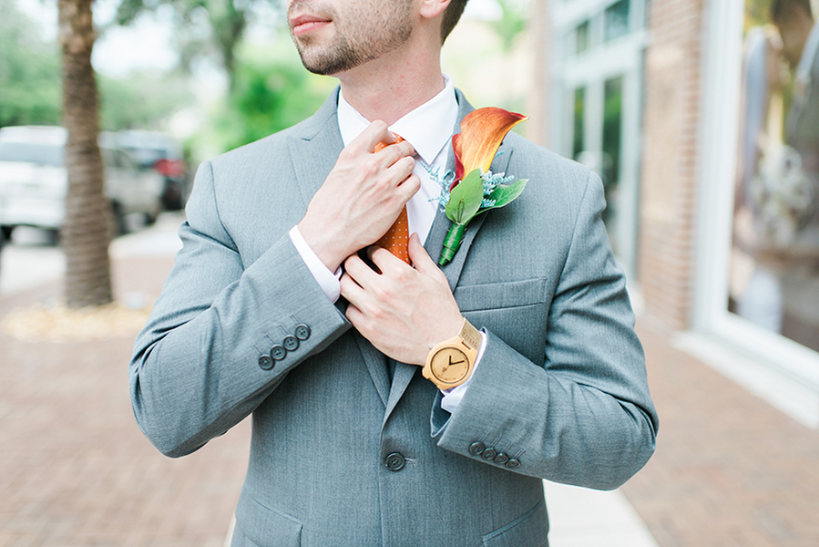 Groom on Wedding Day in Grey Suit and Orange Boutonniere