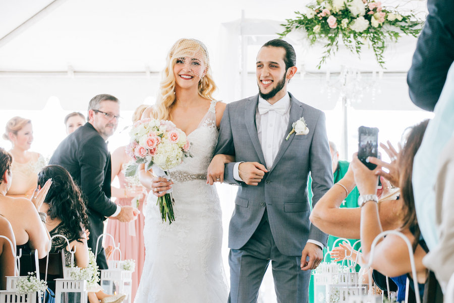 Outdoor South Tampa Wedding Ceremony | Bride and Groom Walking Down Aisle After Saying I Do