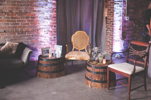 Wedding Reception Vintage Seating Lounge Area with Wooden Barrels | Modern, Unique Exposed Brick Tampa Wedding Venue CL Space in Ybor City