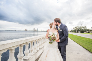 Bride and Groom Kissing on Bayshore Boulevard Wedding Portrait | Tampa Wedding Photographer Rad Red Creative