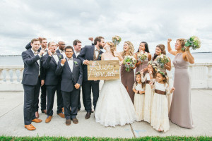 Bridal Party Wedding Portrait Celebrating on Bayshore Boulevard Holding Just Married Sign | Tampa Wedding Photographer Rad Red Creative