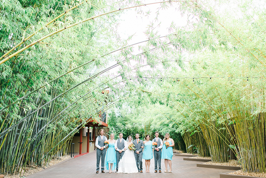 Wedding Bridal Party Portraits with Turquoise Blue Bridesmaid Dresses and Orange Wedding Bouquets | Downtown St. Pete Wedding Venue NOVA 535 Event Space Bamboo Garden