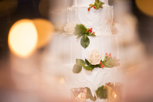 White, Tiered Wedding Cake with White Rose Floral Accents
