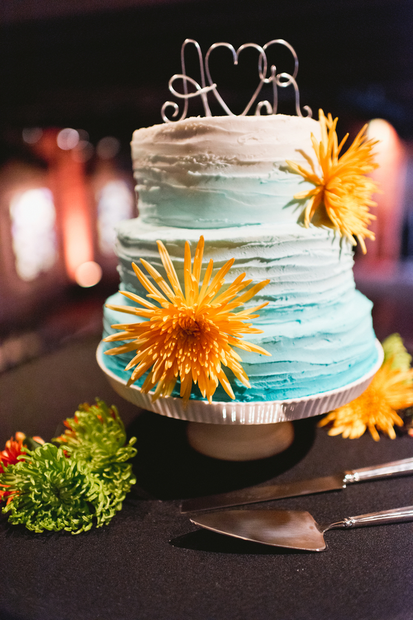 Three Tiered, Round Turquoise Blue Ombre Wedding Cake with Orange Flowers and Monogrammed Initial Cake Topper