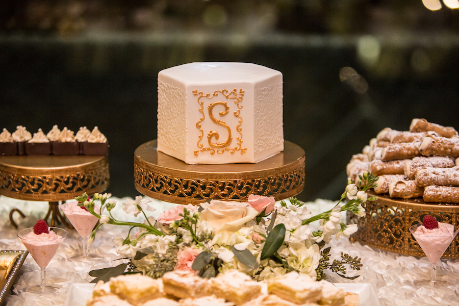 Pink and White Dessert Bar with White and Gold Monogrammed Wedding Cake with Rose Pattern Specialty Linens