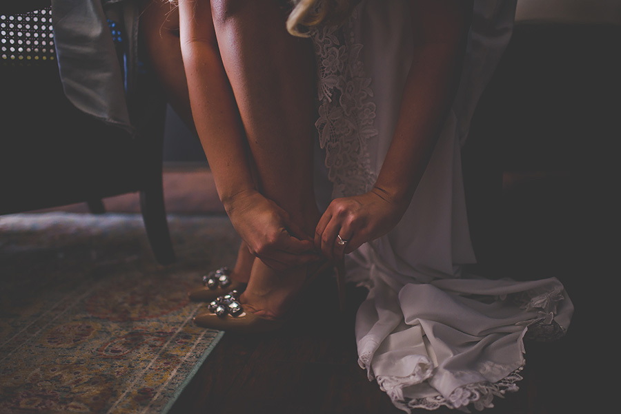 Bride Putting on Sam Edelman Wedding Shoes