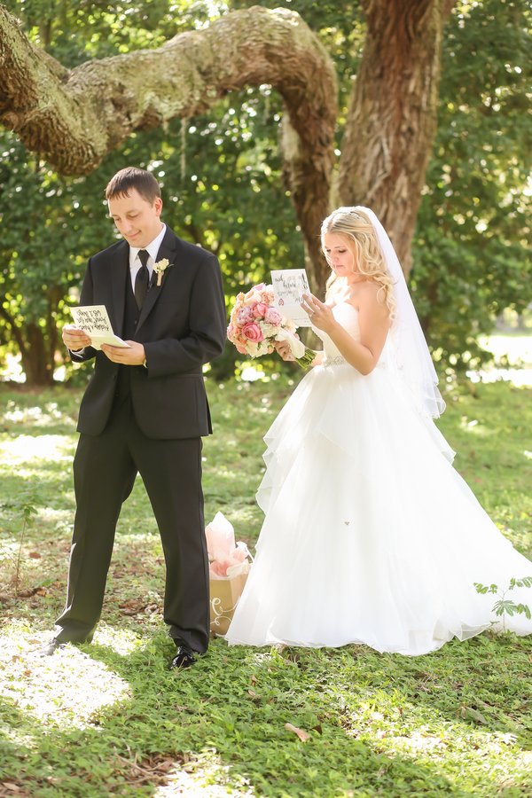 Bride and Groom Reading Wedding Cards during First Look