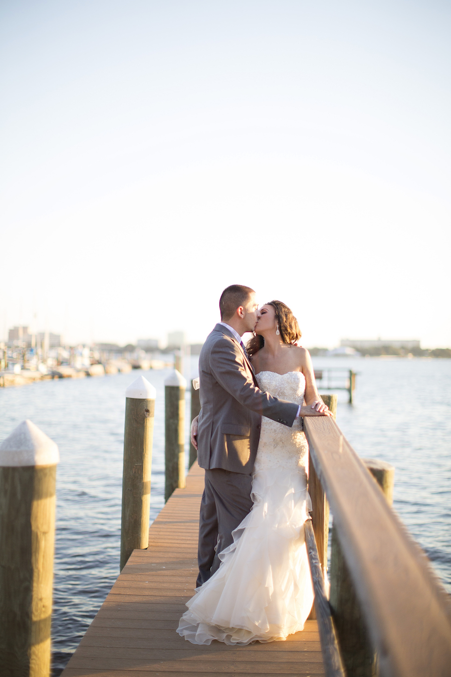 Waterfront Bridal Portrait with Bride and Groom Kissing on Dock | Sarasota Wedding Photography Djamel Photography