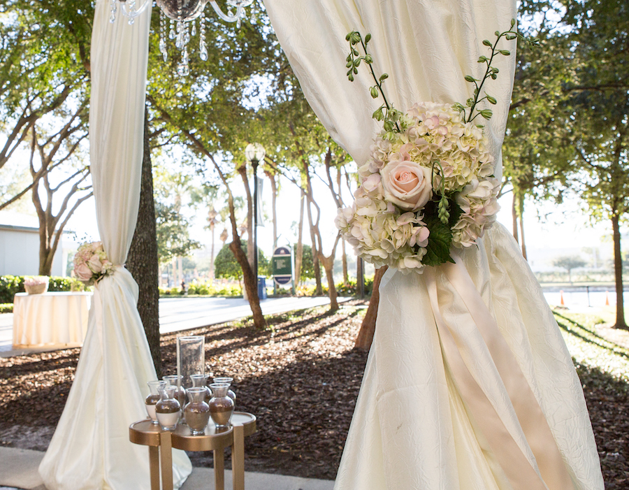 Outdoor Wedding Ceremony Decor with Alter Draping and White and Pink Flowers | Downtown Tampa Wedding Venue The Straz Center