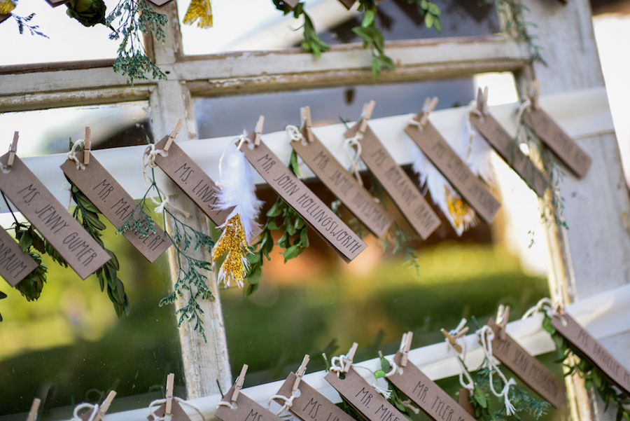 Rustic Seating Chart on Vintage Door with Tiny Clothespins | Wedding Reception Decor