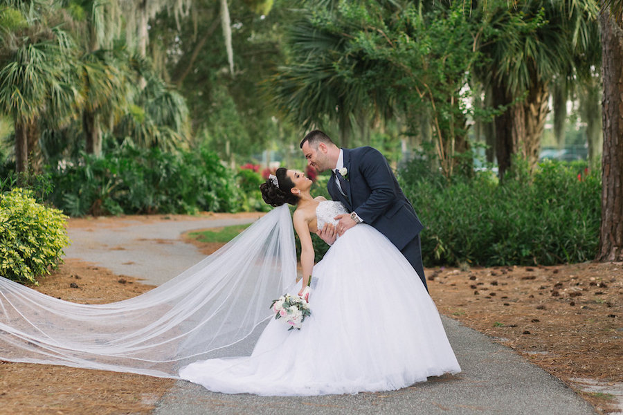 Dramatic Bride & Groom Wedding Portrait with Long Flowing Veil at Clearwater Venue Countryside Country Club