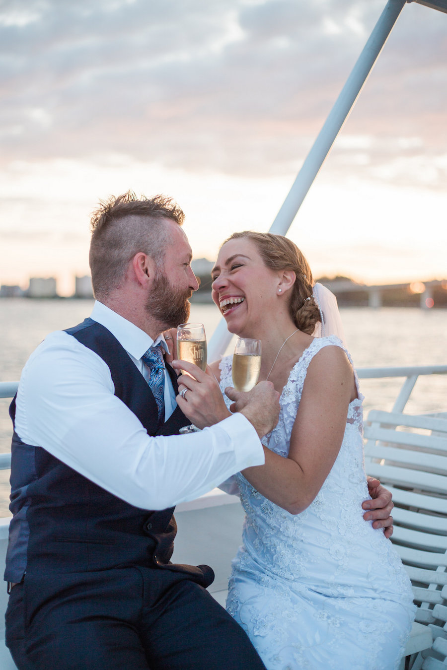 Bride and Groom, Champagne Cheers on Waterfront Wedding Portrait aboard Clearwater Wedding Venue the Yacht Sensation | Jillian Joseph Photography