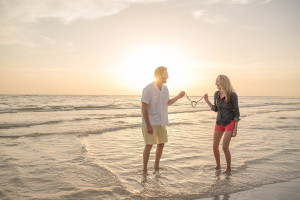 Waterfront Tampa Engagement Session on the Beach , Holding a Tied Knot